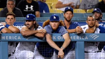 LOS ANGELES, CALIFORNIA - AUGUST 02: Dustin May #85 of the Los Angeles Dodgers watches the ninth inning against the San Diego Padres from the bench at Dodger Stadium on August 02, 2019 in Los Angeles, California. (Photo by Harry How/Getty Images)