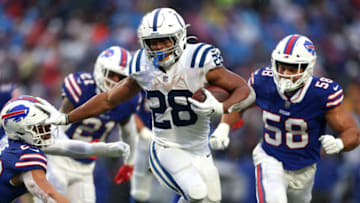 ORCHARD PARK, NEW YORK - NOVEMBER 21: Jonathan Taylor #28 of the Indianapolis Colts runs the ball for a touchdown in the game against the Buffalo Bills during the third quarter at Highmark Stadium on November 21, 2021 in Orchard Park, New York. (Photo by Joshua Bessex/Getty Images)
