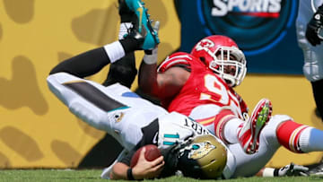 JACKSONVILLE, FL - SEPTEMBER 08: Blaine Gabbert #11 of the Jacksonville Jaguars is sacked by Dontari Poe #92 of the Kansas City Chiefs during the game at EverBank Field on September 8, 2013 in Jacksonville, Florida. (Photo by Sam Greenwood/Getty Images)