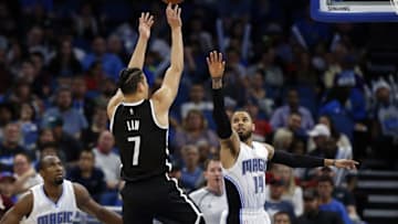 Dec 16, 2016; Orlando, FL, USA; Brooklyn Nets guard Jeremy Lin (7) shoots over Orlando Magic guard D.J. Augustin (14) during the second quarter at Amway Center. Mandatory Credit: Kim Klement-USA TODAY Sports
