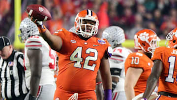 Dec 31, 2016; Glendale, AZ, USA; Clemson defensive lineman Christian Wilkins (42) reacts after recovering a fumble by Ohio State running back Mike Weber (not pictured) during the third quarter in the 2016 CFP semifinal at University of Phoenix Stadium. Mandatory Credit: Matt Kartozian-USA TODAY Sports