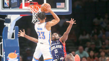 Tre Mann #23 of the Oklahoma City Thunder collides with Robert Franks #0 of the Adelaide 36ers while shooting during the first quarter at Paycom Center on October 06, 2022 in Oklahoma City, Oklahoma. (Photo by Ian Maule/Getty Images)