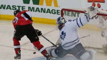Apr 12, 2014; Ottawa, Ontario, CAN; Toronto Maple Leafs golaie James Reimer (34) makes a save on a breakaway shot from Ottawa Senators left wing Milan Michalek (9) in the third period at the Canadian Tire Centre. The Senators defeated the Maple Leafs 1-0. Mandatory Credit: Marc DesRosiers-USA TODAY Sports