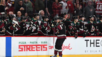 GLENDALE, ARIZONA - JANUARY 12: Taylor Hall #91 of the Arizona Coyotes celebrates with teammates on the bench after scoring a goal against the Pittsburgh Penguins at Gila River Arena on January 12, 2020 in Glendale, Arizona. (Photo by Norm Hall/NHLI via Getty Images)