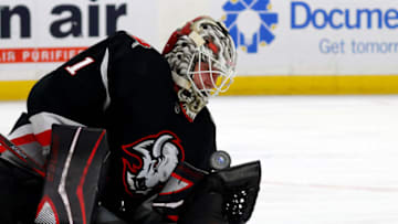 Jan 7, 2023; Buffalo, New York, USA; Buffalo Sabres goaltender Ukko-Pekka Luukkonen (1) makes a glove save during the first period against the Minnesota Wild at KeyBank Center. Mandatory Credit: Timothy T. Ludwig-USA TODAY Sports