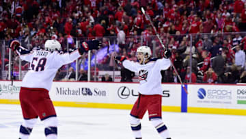 WASHINGTON, DC - APRIL 12: Artemi Panarin #9 of the Columbus Blue Jackets celebrates with David Savard #58 after scoring the game-winning goal in overtime against the Washington Capitals in Game One of the Eastern Conference First Round during the 2018 NHL Stanley Cup Playoffs at Capital One Arena on April 12, 2018 in Washington, DC. (Photo by Patrick McDermott/NHLI via Getty Images)