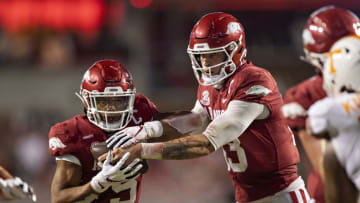 FAYETTEVILLE, AR - NOVEMBER 7: Feleipe Franks #13 of the Arkansas Razorbacks hands off the ball to Rakeem Boyd #5 in the second half of a game against the Tennessee Volunteers at Razorback Stadium on November 7, 2020 in Fayetteville, Arkansas. The Razorbacks defeated the Volunteers 24-13. (Photo by Wesley Hitt/Getty Images)