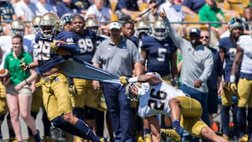 Apr 16, 2016; South Bend, IN, USA; Notre Dame Fighting Irish safety Ashton White (26) grabs onto the jersey of wide receiver Kevin Stepherson (29) in the second quarter of the Blue-Gold Game at Notre Dame Stadium. The Blue team defeated the Gold team 17-7. Mandatory Credit: Matt Cashore-USA TODAY Sports
