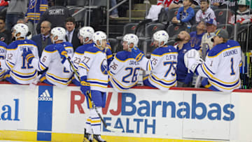 Oct 27, 2023; Newark, New Jersey, USA; Buffalo Sabres right wing JJ Peterka (77) celebrates his goal with teammates during the first period against the New Jersey Devils at Prudential Center. Mandatory Credit: Vincent Carchietta-USA TODAY Sports