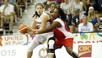 Jul 18, 2015; Toronto, Ontario, CAN; Canada center Natalie Achonwa (11) drives to the basket against Cuba forward Clenia Noblet (12) in the women