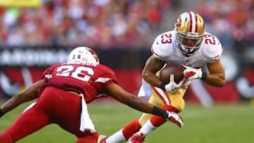 Dec 29, 2013; Phoenix, AZ, USA; San Francisco 49ers running back LaMichael James (23) runs the ball in the second half against the Arizona Cardinals at University of Phoenix Stadium. The 49ers defeated the Cardinals 23-20. Mandatory Credit: Mark J. Rebilas-USA TODAY Sports