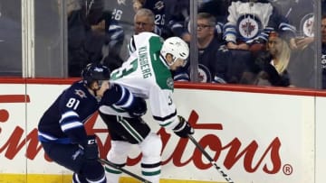 Oct 27, 2016; Winnipeg, Manitoba, CAN; Winnipeg Jet forward Kyle Connor (81) battles Dallas Stars defenseman John Klingberg (3) for the puck during the second period at MTS Centre. Mandatory Credit: Bruce Fedyck-USA TODAY Sports