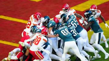 Feb 12, 2023; Glendale, AZ, USA; Philadelphia Eagles quarterback Jalen Hurts (1) scores a touchdown on a quarterback sneak against the Kansas City Chiefs during the first quarter in Super Bowl LVII at State Farm Stadium. Mandatory Credit: Patrick Breen/The Republic via USA TODAY Sports
