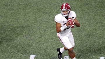 ATLANTA, GA - JANUARY 08: Quarterback Tua Tagovailoa #13 of the Alabama Crimson Tide drops back to pass during the College Football Playoff National Championship game against the Georgia Bulldogs at Mercedes-Benz Stadium on January 8, 2018 in Atlanta, Georgia. (Photo by Mike Zarrilli/Getty Images)