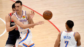 WASHINGTON, DC - APRIL 19: Aleksej Pokusevski #17 of the Oklahoma City Thunder passes to Darius Bazley #7 in front of Deni Avdija #9 of the Washington Wizards during the second half at Capital One Arena on April 19, 2021 in Washington, DC. NOTE TO USER: User expressly acknowledges and agrees that, by downloading and or using this photograph, User is consenting to the terms and conditions of the Getty Images License Agreement. (Photo by Will Newton/Getty Images)