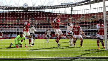 LONDON, ENGLAND - APRIL 18: Eddie Nketiah of Arsenal (R) scores their team's first goal during the Premier League match between Arsenal and Fulham at Emirates Stadium on April 18, 2021 in London, England. Sporting stadiums around the UK remain under strict restrictions due to the Coronavirus Pandemic as Government social distancing laws prohibit fans inside venues resulting in games being played behind closed doors. (Photo by Ian Walton - Pool/Getty Images)