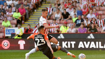 SHEFFIELD, ENGLAND - AUGUST 04: Ben Woodburn of Sheffield United and Liverpool is tackled by Connor Roberts of Swansea City during the Sky Bet Championship between Sheffield United and Swansea City at Bramall Lane on August 4, 2018 in Sheffield, England. (Photo by George Wood/Getty Images)