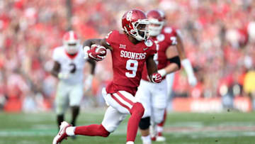 PASADENA, CA - JANUARY 01: Wide receiver CeeDee Lamb #9 of the Oklahoma Sooners runs after a catch against the Georgia Bulldogs in the first half in the 2018 College Football Playoff Semifinal at the Rose Bowl Game presented by Northwestern Mutual at the Rose Bowl on January 1, 2018 in Pasadena, California. (Photo by Matthew Stockman/Getty Images)