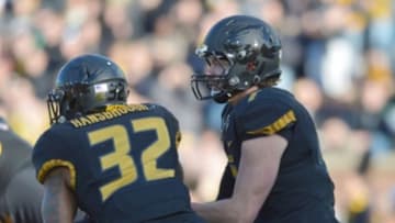 Nov 28, 2014; Columbia, MO, USA; Missouri Tigers quarterback Maty Mauk (7) hands off to running back Russell Hansbrough (32) during the first half against the Arkansas Razorbacks at Faurot Field. Mandatory Credit: Denny Medley-USA TODAY Sports