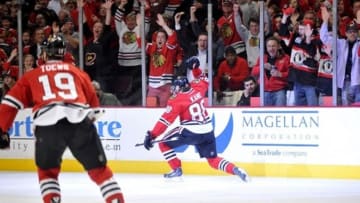 Jun 8, 2013; Chicago, IL, USA; Chicago Blackhawks right wing Patrick Kane (88) celebrates after scoring a goal against the Los Angeles Kings during the first period in game five of the Western Conference finals of the 2013 Stanley Cup Playoffs at the United Center. Mandatory Credit: Rob Grabowski-USA TODAY Sports
