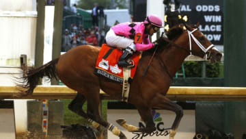 LOUISVILLE, KENTUCKY - MAY 04: Maximum Security #7, ridden by jockey Luis Saez crosses the finish line to win the 145th running of the Kentucky Derby at Churchill Downs on May 04, 2019 in Louisville, Kentucky. (Photo by Michael Reaves/Getty Images)