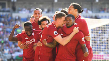 CARDIFF, WALES - APRIL 21: Georginio Wijnaldum of Liverpool is surrounded by team mates after scoring during the Premier League match between Cardiff City and Liverpool FC at Cardiff City Stadium on April 21, 2019 in Cardiff, United Kingdom. (Photo by Mike Hewitt/Getty Images)
