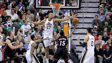 Dec 12, 2014; Salt Lake City, UT, USA; Utah Jazz center Rudy Gobert (27) tries to block the shot of Miami Heat guard Mario Chalmers (15) during the fourth quarter at EnergySolutions Arena. Miami Heat won the game 100-95. Mandatory Credit: Chris Nicoll-USA TODAY Sports