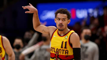Jan 17, 2022; Atlanta, Georgia, USA; Atlanta Hawks guard Trae Young (11) celebrates a three-point basket during the fourth quarter against the Milwaukee Bucks at State Farm Arena. Mandatory Credit: Jason Getz-USA TODAY Sports