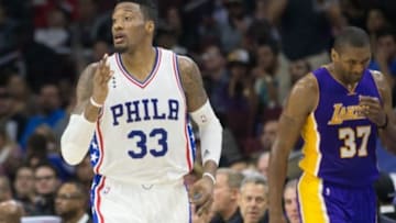 Dec 1, 2015; Philadelphia, PA, USA; Philadelphia 76ers forward Robert Covington (33) reacts in front of Los Angeles Lakers forward Metta World Peace (37) after his three point score during the first half at Wells Fargo Center. The 76ers won 103-91. Mandatory Credit: Bill Streicher-USA TODAY Sports