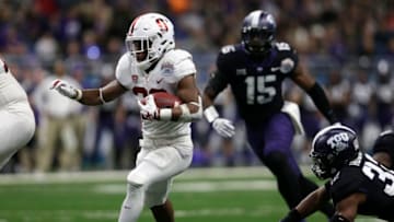 SAN ANTONIO, TX - DECEMBER 28: Bryce Love #20 of the Stanford Cardinal rushes past Travin Howard #32 of the TCU Horned Frogs for a touchdown in the first quarter during the Valero Alamo Bowl at the Alamodome on December 28, 2017 in San Antonio, Texas. (Photo by Tim Warner/Getty Images)