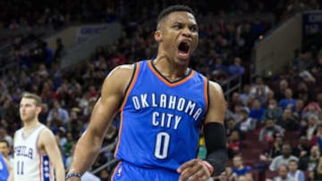 Mar 18, 2016; Philadelphia, PA, USA; Oklahoma City Thunder guard Russell Westbrook (0) reacts to his dunk against the Philadelphia 76ers during the third quarter at Wells Fargo Center. The Oklahoma City Thunder won 111-97.Mandatory Credit: Bill Streicher-USA TODAY Sports