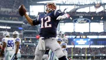 Oct 11, 2015; Arlington, TX, USA; New England Patriots quarterback Tom Brady (12) celebrates scoring a touchdown against the Dallas Cowboys at AT&T Stadium. Mandatory Credit: Erich Schlegel-USA TODAY Sports