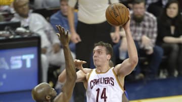 Apr 13, 2016; Cleveland, OH, USA; Cleveland Cavaliers center Sasha Kaun (14) shoots against Detroit Pistons center Joel Anthony (50) in the second quarter at Quicken Loans Arena. Mandatory Credit: David Richard-USA TODAY Sports