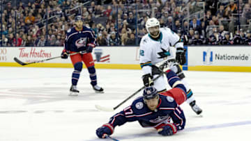 COLUMBUS, OH - FEBRUARY 02: San Jose Sharks right wing Joel Ward (42) pushes Columbus Blue Jackets center Brandon Dubinsky (17) down in the third period of a game between the Columbus Blue Jackets and the San Jose Sharks on February 02, 2018 at Nationwide Arena in Columbus, OH. The Sharks won 3-1. (Photo by Adam Lacy/Icon Sportswire via Getty Images)