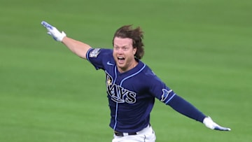 Brett Phillips #14 of the Tampa Bay Rays celebrates after hitting a ninth inning two-run walk-off single to defeat the Los Angeles Dodgers 8-7 in Game Four of the 2020 MLB World Series at Globe Life Field on October 24, 2020 in Arlington, Texas. (Photo by Ronald Martinez/Getty Images)