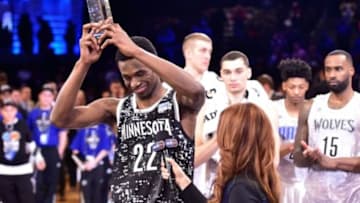 Feb 13, 2015; New York, NY, USA; World Team guard Andrew Wiggins of the Minnesota Timberwolves (22) hoists the MVP trophy after the game against the U.S. Team at Barclays Center. Mandatory Credit: Bob Donnan-USA TODAY Sports