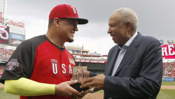 Jul 12, 2015; Cincinnati, OH, USA; USA catcher Kyle Schwarber (left) is presented the MVP trophy from baseball great Frank Robinson (right) after the All Star Futures Game with the World Team at Great American Ballpark. Mandatory Credit: David Kohl-USA TODAY Sports