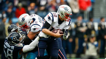 NASHVILLE, TN - NOVEMBER 11: Harold Landry #58 of the Tennessee Titans gets a hand on Tom Brady #12 of the New England Patriots during the second quarter at Nissan Stadium on November 11, 2018 in Nashville, Tennessee. (Photo by Wesley Hitt/Getty Images)