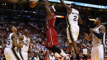 Dec 16, 2013; Miami, FL, USA; Miami Heat small forward LeBron James (6) dunks the ball against Utah Jazz power forward Marvin Williams (2) in the first half at American Airlines Arena. Mandatory Credit: Robert Mayer-USA TODAY Sports