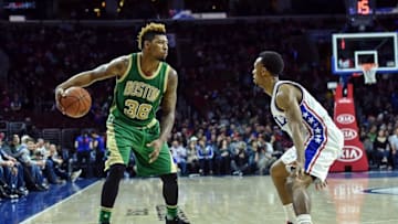 Mar 20, 2016; Philadelphia, PA, USA; Boston Celtics guard Marcus Smart (36) looks to get the ball past Philadelphia 76ers guard Ish Smith (1) during the fourth quarter of the game at the Wells Fargo Center. The Celtics won the game 120-105. Mandatory Credit: John Geliebter-USA TODAY Sports
