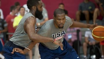 Jul 30, 2014; Las Vegas, NV, USA; Team USA guard Kevin Durant (right) dribbles the ball against guard James Harden (left) during a team practice session at Mendenhall Center. Mandatory Credit: Stephen R. Sylvanie-USA TODAY Sports