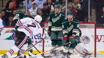 Apr 9, 2013; St. Paul, MN, USA; Minnesota Wild defensemN Nate Prosser (39) and defenseman Ryan Suter (20) attempt to block a shot against the Chicago Blackhawks at the Xcel Energy Center. The Blackhawks defeated the Wild 1-0. Mandatory Credit: Brace Hemmelgarn-USA TODAY Sports