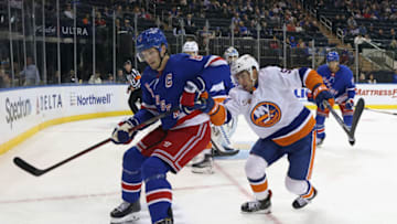NEW YORK, NEW YORK - SEPTEMBER 26: Cole Bardreau #54 of the New York Islanders skates against Jacob Trouba #8 of the New York Rangers during the third period at Madison Square Garden on September 26, 2022 in New York City. The Rangers defeated the Islanders 4-1. (Photo by Bruce Bennett/Getty Images)