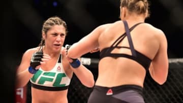 Aug 1, 2015; Rio de Janeiro, RJ, Brazil; Ronda Rousey (red gloves) fights Bethe Correia (blue gloves) during UFC 190 at HSBC Arena. Mandatory Credit: Jason Silva-USA TODAY Sports
