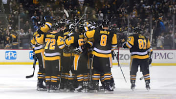 PITTSBURGH, PA - JANUARY 07: The Pittsburgh Penguins celebrate their overtime win against the Boston Bruins at PPG PAINTS Arena on January 7, 2018 in Pittsburgh, Pennsylvania. (Photo by Matt Kincaid/Getty Images)