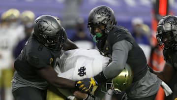 Oct 24, 2020; Pittsburgh, Pennsylvania, USA; Pittsburgh Panthers defensive lineman Calijah Kancey (8) and defensive lineman Rashad Weaver (17) sack Notre Dame Fighting Irish quarterback Brendon Clark (7) during the third quarter at Heinz Field. The Irish won 45-3. Mandatory Credit: Charles LeClaire-USA TODAY Sports