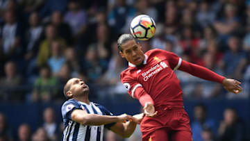WEST BROMWICH, ENGLAND - APRIL 21: Virgil van Dijk of Liverpool wins a header under pressure from Jose Salomon Rondon of West Bromwich Albion during the Premier League match between West Bromwich Albion and Liverpool at The Hawthorns on April 21, 2018 in West Bromwich, England. (Photo by Laurence Griffiths/Getty Images)
