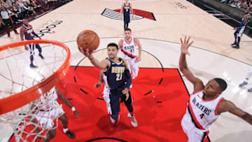 PORTLAND, OR - NOVEMBER 13: Jamal Murray #27 of the Denver Nuggets drives to the basket against the Portland Trail Blazers on November 13, 2017 at the Moda Center in Portland, Oregon. NOTE TO USER: User expressly acknowledges and agrees that, by downloading and or using this Photograph, user is consenting to the terms and conditions of the Getty Images License Agreement. Mandatory Copyright Notice: Copyright 2017 NBAE (Photo by Sam Forencich/NBAE via Getty Images)