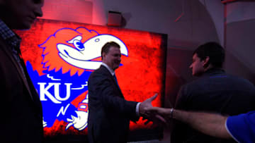 KANSAS CITY, MO - MARCH 12: Bill Self head coach of the Kansas Jayhawks slaps a fans hand as he heads to the locker room after Kansas won the Big 12 Basketball Tournament against the West Virginia Mountaineers at Sprint Center on March 12, 2016 in Kansas City, Missouri. (Photo by Ed Zurga/Getty Images)