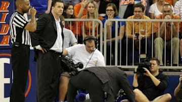 February 12, 2013; Gainesville, FL, USA; Kentucky Wildcats forward Nerlens Noel (3) is checked on by head coach John Calipari after suffering an knee injury against the Florida Gators during the second half at the Stephen C. O